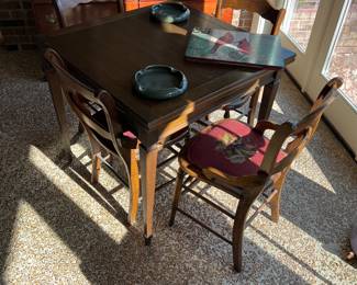 Game table and chairs. Top folds and doubles the size