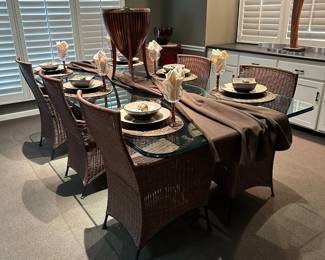 Custom Glass Top Dining Room Table on Cast Iron Bases with High Back Wicker Chairs