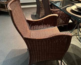 Custom Glass Top Dining Room Table on Cast Iron Bases with High Back Wicker Chairs