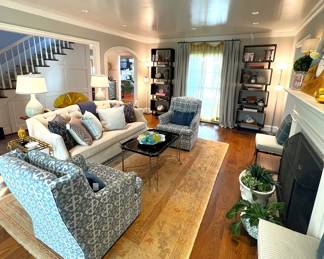 White velvet custom sofa, custom swivel chairs, Dennis & Leen coffee table, antique Oushak carpet