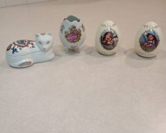 Elizabeth Arden Cat                                                                                                                                                                       Limoges Egg Shaped Vase                                                                                                                                  Hummel Porcelain Eggs                                                                                                                   
