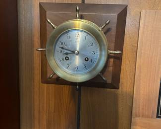 . . . a great brass 8-day-wind ship's wheel clock