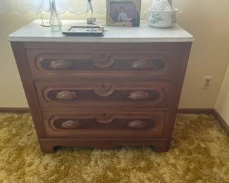 . . . Victorian three-drawer dresser with carved drawer pulls
