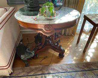 . . . Victorian marble-topped table