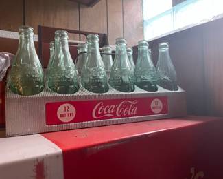 . . .  vintage Coke carrier filled with vintage Coke bottles