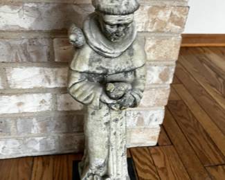 Statue. Many religious items. 