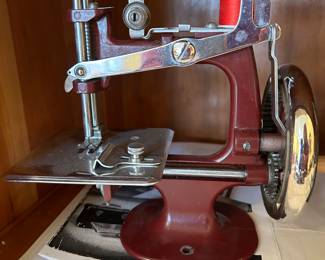	#65	Burgundy hand sewing machine burgundy	 $50.00 				