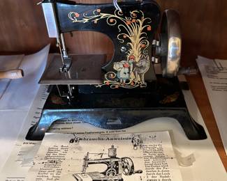 	#66	Black German hand sewing machine	 $100.00 				