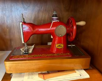 	#64	Red Russian hand sewing machine	 $50.00 				