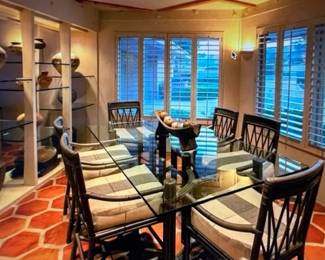 DRmTable Chairs with Neolithic Chinese and Han Pottery on glass shelves to the left