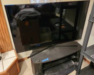 Samsung 47" tv with black cabinet 14 x 34 x 21 works with remote and antenna