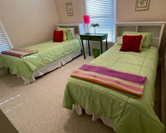 twin beds with bookshelf headboards