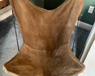 $90. Suede covered butterfly chair from the 1960's.  Cover is as found - needs some reinforcement to some of the stitching. 32"w x 34"d x 34"h.