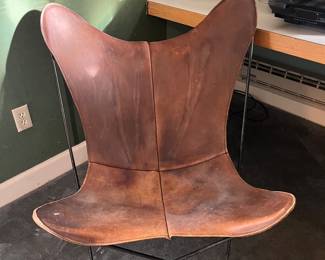 $290. Leather covered butterfly chair from the 1960's.  32"w x 34"d x 34"h.