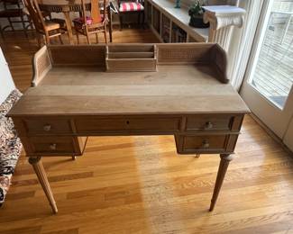 $220. Antique desk with caned sides on upper area.  40"w x 21"d x 34"h