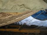 bottom of wooden boat in back yard for sale with trailor