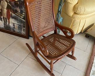 Vintage child's caned rocking chair