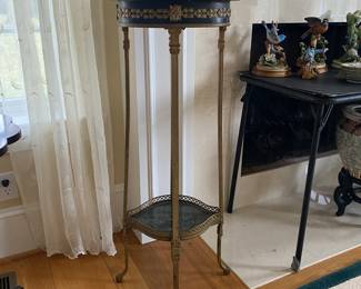 Marble top stand with gilt metal legs