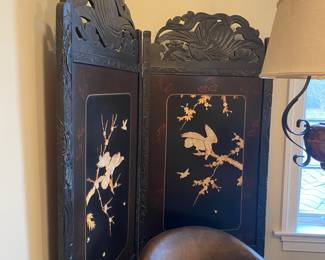 Carved wood screen with applied decorations