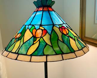 Wrought iron floor lamp with stained glass shade