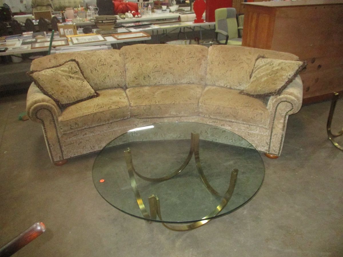 Sofa and brass and glass coffee table