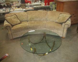 Sofa and brass and glass coffee table