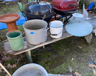 Old wood bench with metal and ceramic pots