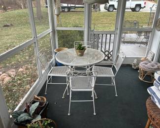 wrought iron table and 4 chairs from the early 50's