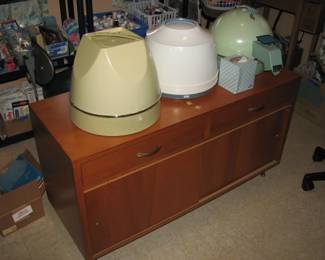 3 vintage hair dryers and a nice cabinet