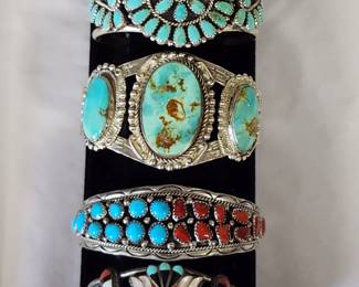 Many signed Sterling and Turquoise Native American Jewelry Pieces. Cuff Bracelets including, Larry Moses Begay, Navajo, and J. J. Niiha, Zuni.