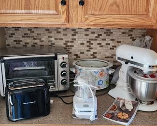Toaster oven, toaster, crock pot, Kitchen Aid mixer and attachments, and chopper.