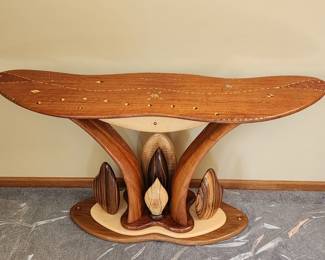 Handcrafted Artist Carved Table by Steven Spiro. Contains inlays with a variety of woods. Measures 56" wide x 29" high x 14" deep.