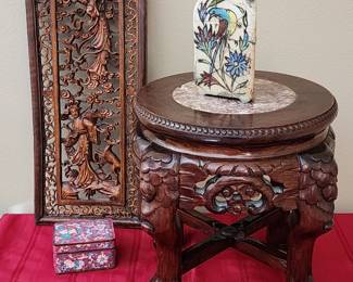 Oriental carved wall hanging, and marble top carved stand.