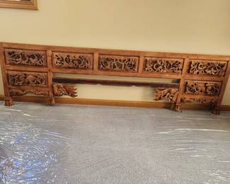Indonesian Carved Opium Bed Footboard. Measures 72" wide x 24" high.