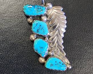 Many signed Sterling and Turquoise Native American Jewelry Pieces. Pendant.
Zuni EMY