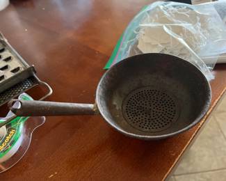 Vintage small tin strainer
