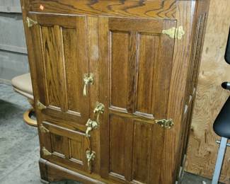 Antique oak refrigerator with water spigot