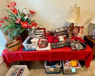 tons of scarves and designer purses