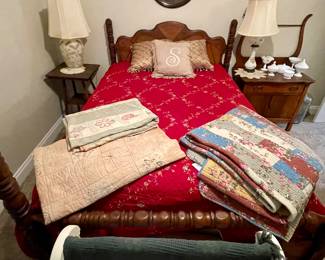 antique walnut full size bed with good mattress, several quilts and bedspreads