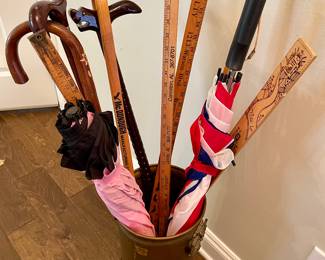 canes, yardsticks, upside down umbrella/cane, brass umbrella stand