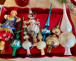 several Christmas tree toppers
