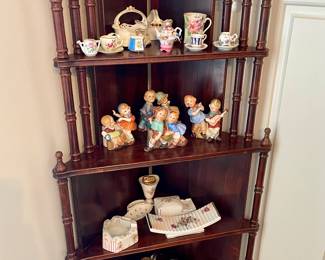 antique mahogany corner cabinet with brass feet