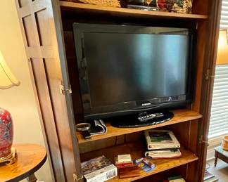 Arts and Crafts style tv cabinet, split oak basket, books, Samsung flat screen tv
