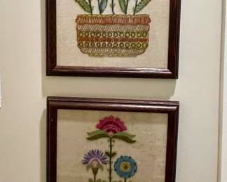 pair of framed crewelwork florals