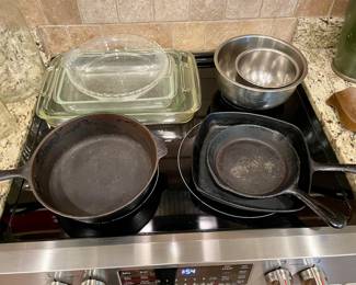 cast iron pans, glass baking dishes, stainless mixing bowls