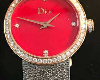 8- Dior - Christian Dior - Model D Dior, large model 25mm, stainless steel bracelet, and bezel pink gold and diamond, red lacquer face. $3,600