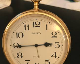 27 - $34 Seiko pocket watch style desk clock.