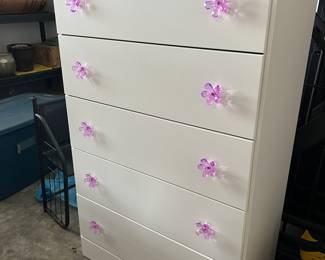 White dresser with flower drawer pulls
