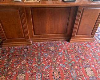 Rug under executive desk sold.