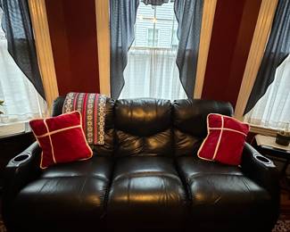 Black theatre style couch. Both end sections recline